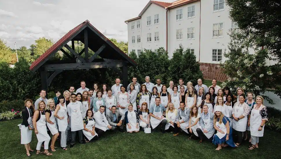 merck team on lawn at normandy farm workcation