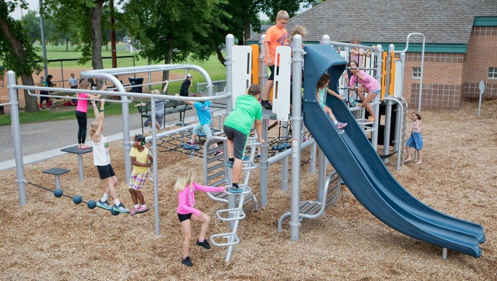Children playing on playground equipment