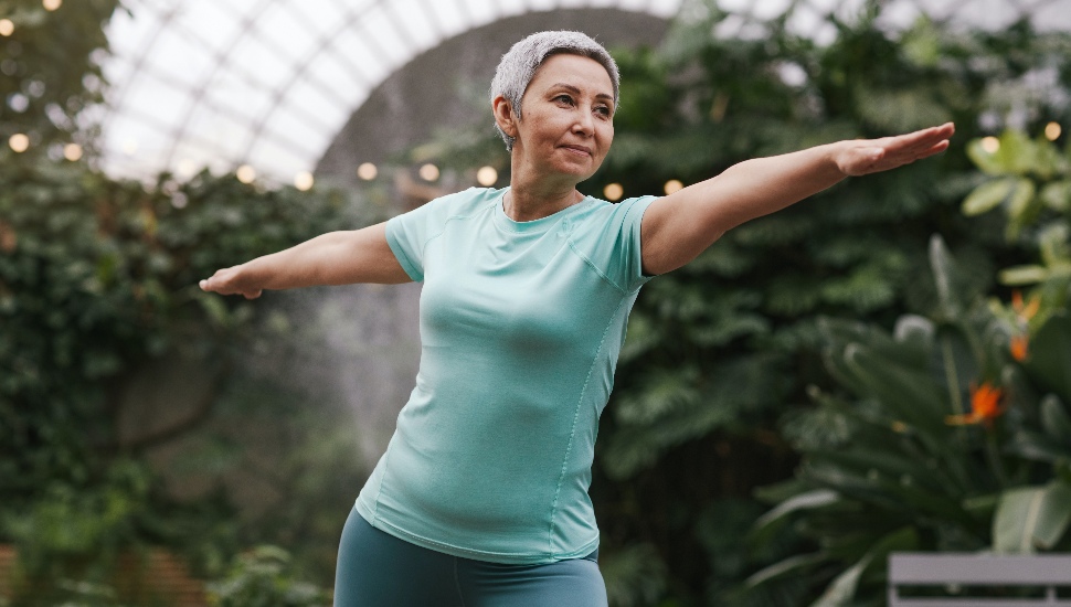 woman doing yoga in healthiest counties