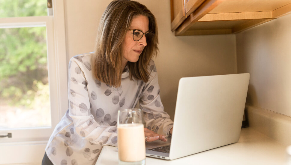 Woman working from her kitchen