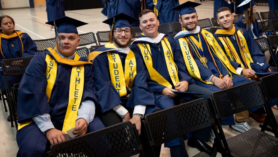 Student athletes at Neumann University ready to receive their diplomas.