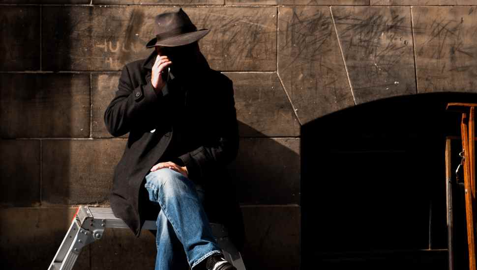 man in hat on phone