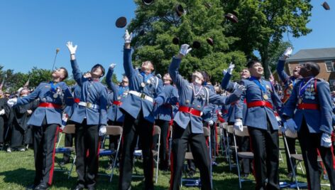Graduates toss their covers in the air at Valley Forge Military Academy & College.