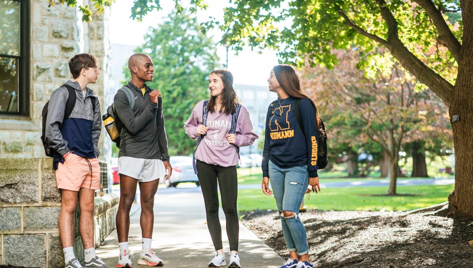 College students talking on campus.
