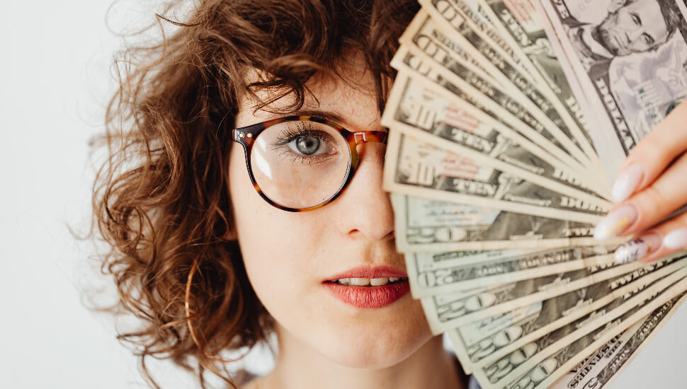 Woman holding Cash
