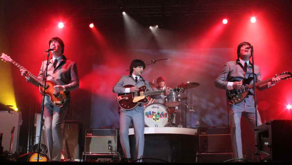four-piece band in suits