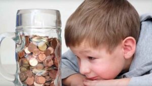kid with penny jar
