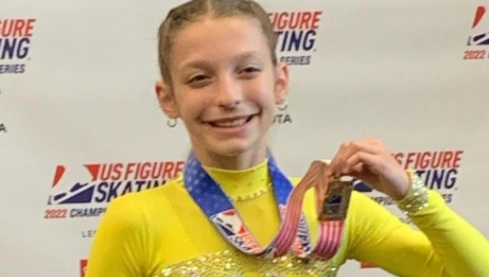 Meghan Huffman holding a medal