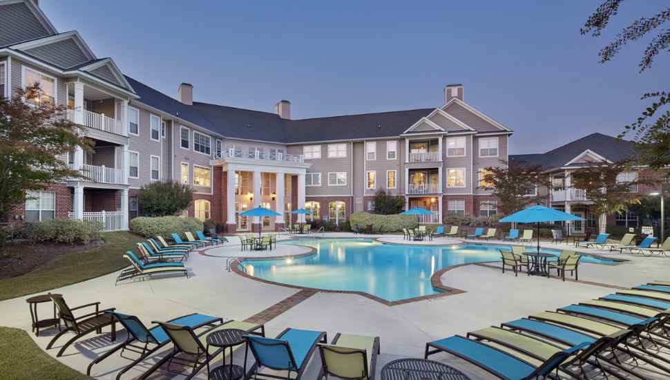 building with pool and chairs