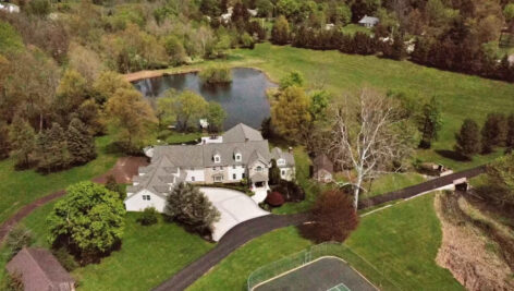 large house next to pond