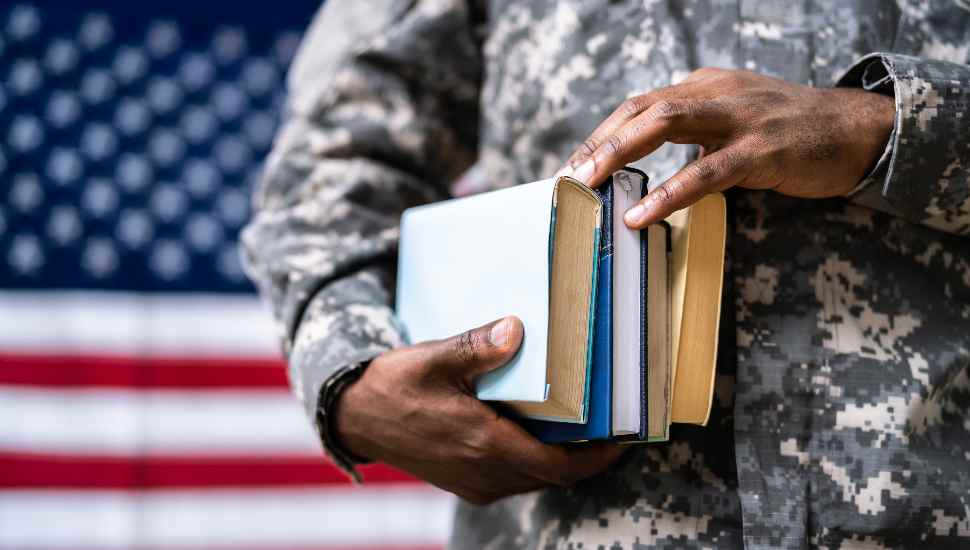 man in uniform with books