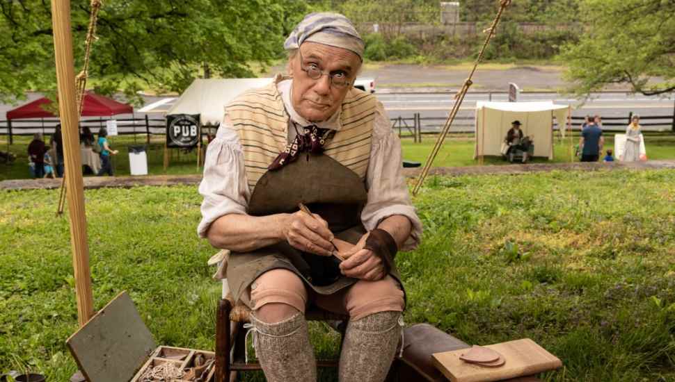 man making shoes