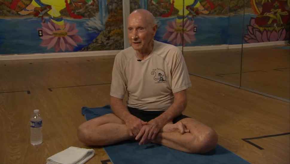 man sitting cross-legged
