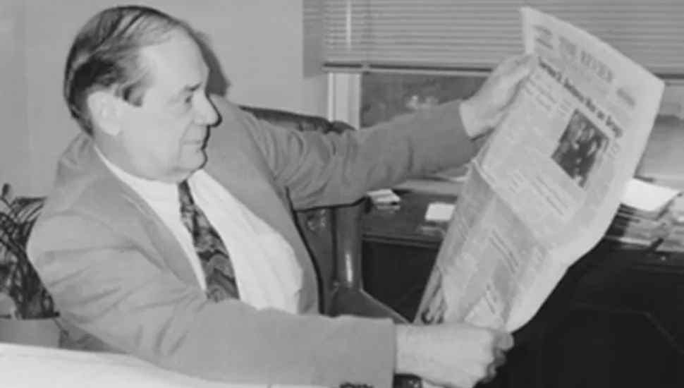 man with newspaper