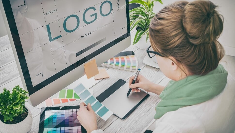 Graphic Designer at her desk