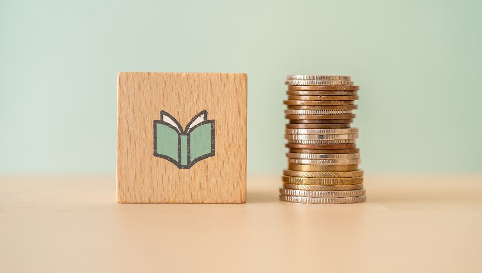 block and stack of coins
