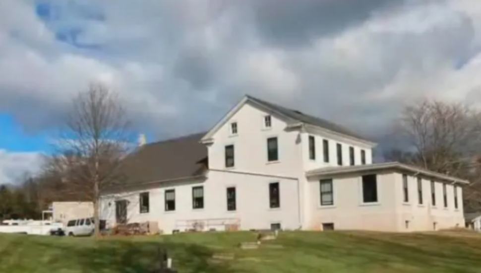 white building on a green lawn
