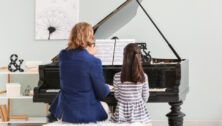 woman and little girl at piano