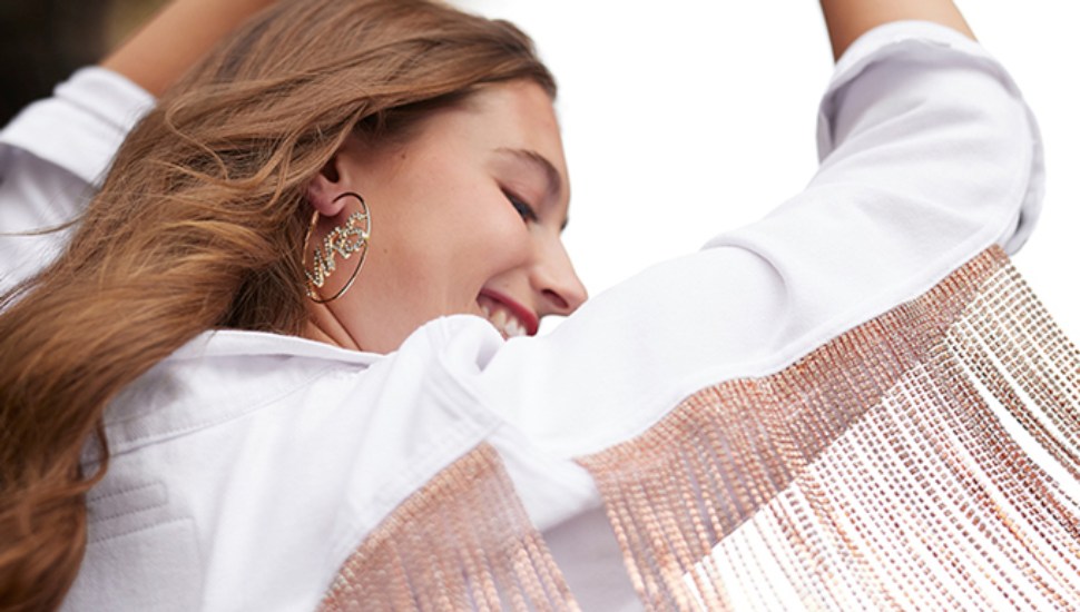 woman in white jacket with fringe