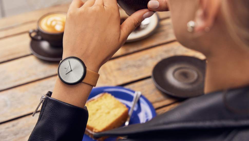 woman wearing watch, drinking coffee