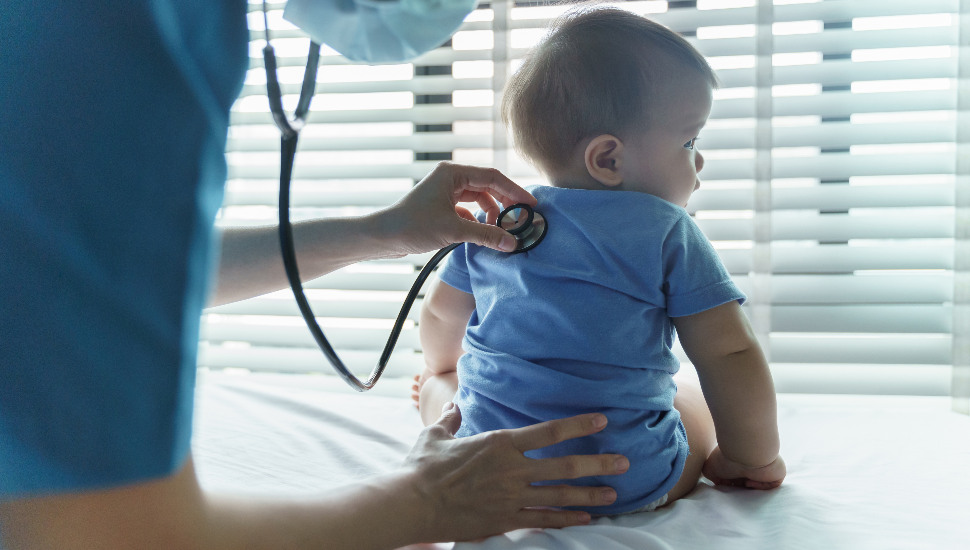 baby getting examined