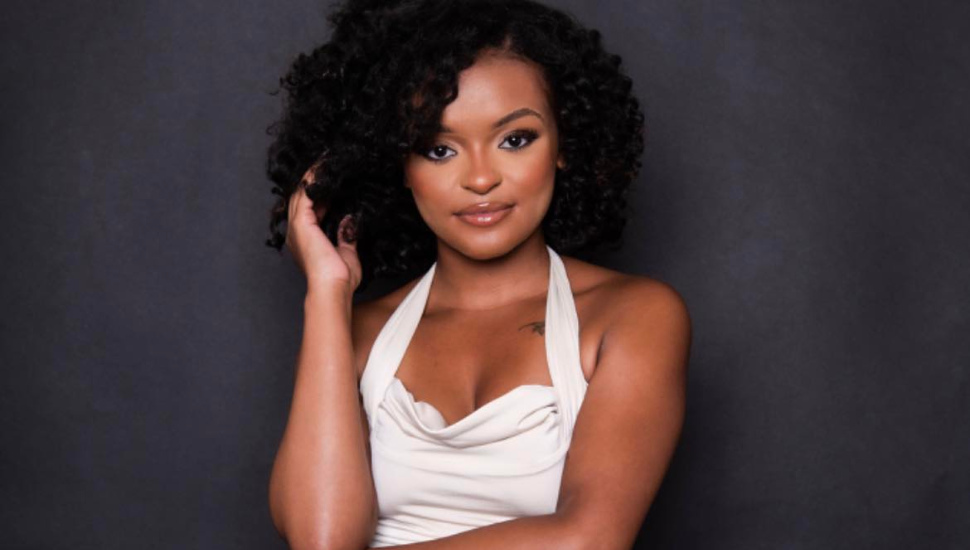black woman in white dress
