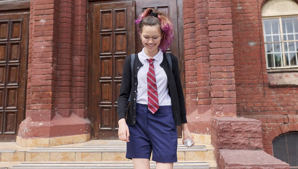 girl in uniform on steps