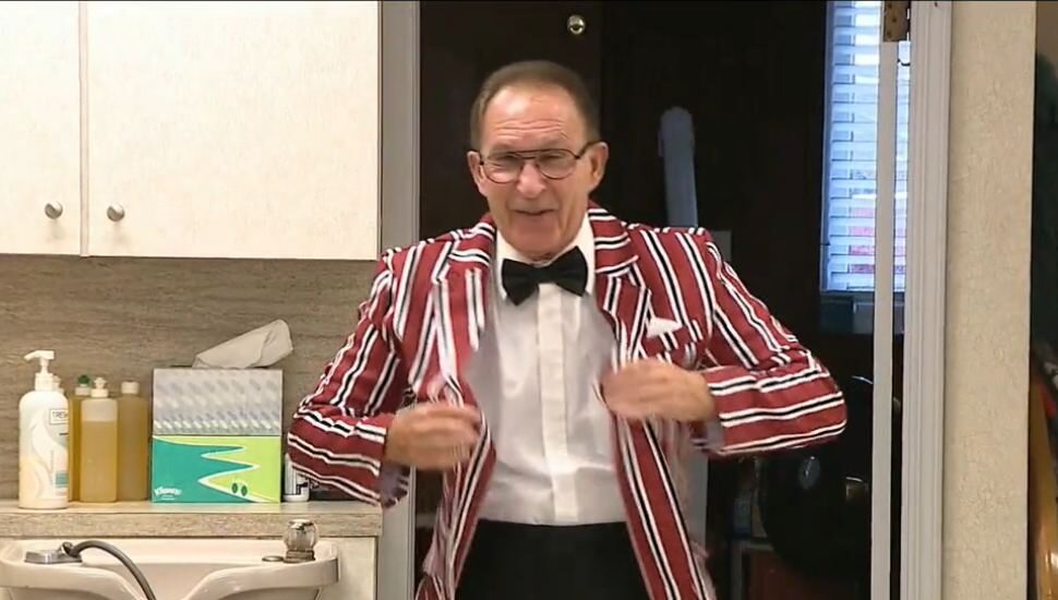 man in candy-cane striped jacket