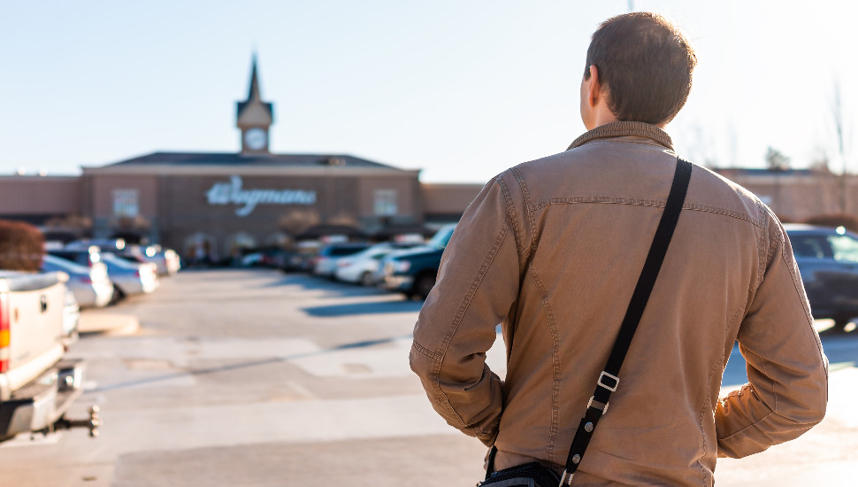 man in front of store