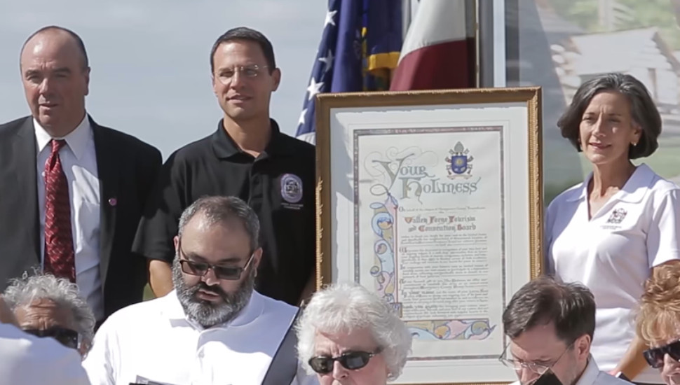 people with framed document