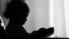 silhouette of child with dish