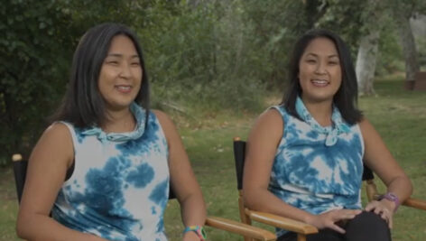 two women in blue shirts