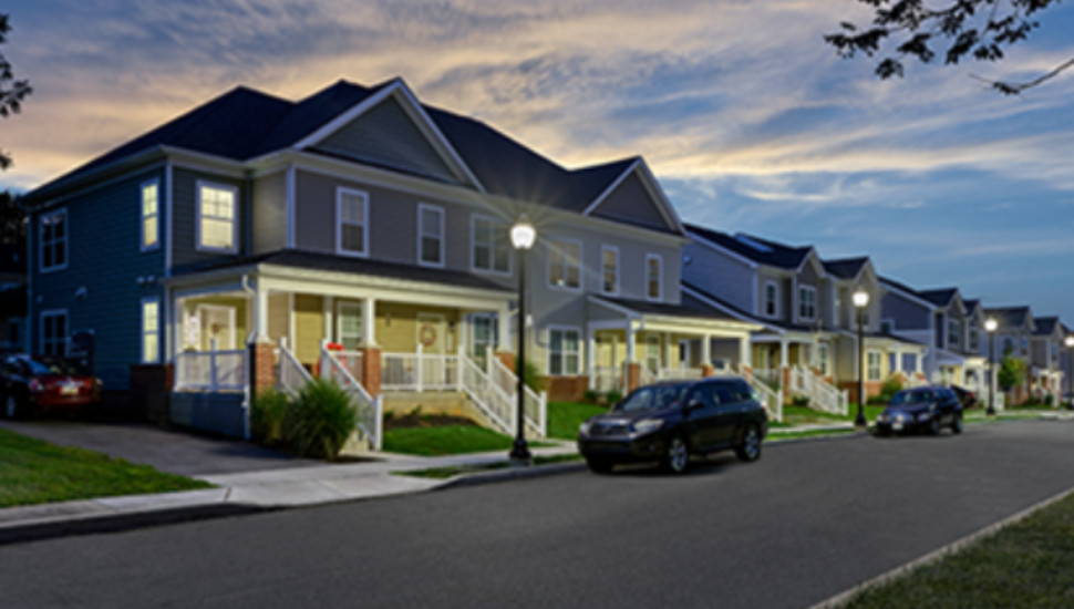 houses lit at dusk