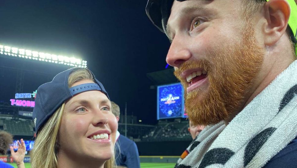 man and woman at baseball stadium