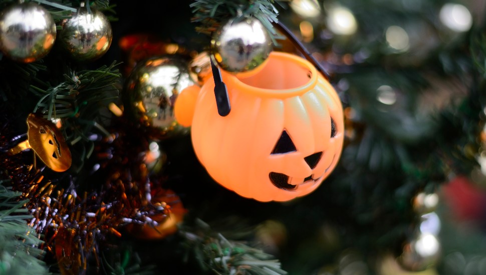 plastic jack o'lantern on a christmas tree