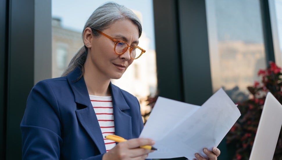 woman looking at resume summary