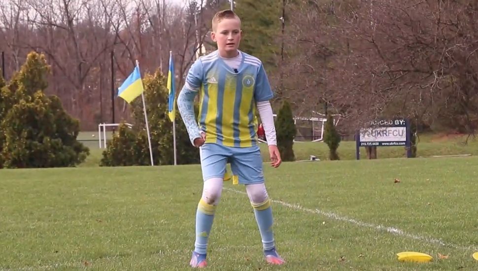 boy in blue-yellow shirt