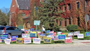 orner plot overrun with lawn signs
