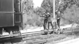 men on train tracks