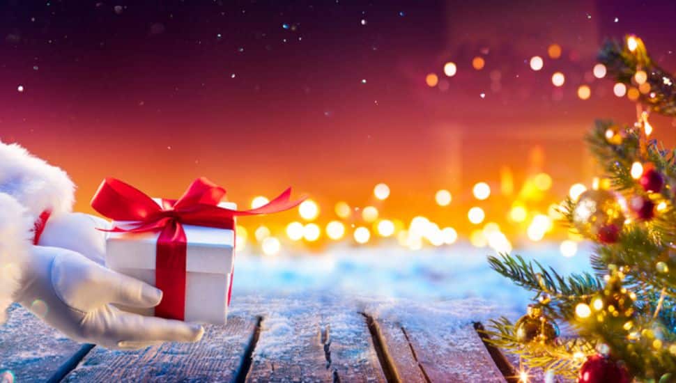 white gloved hands holding a present