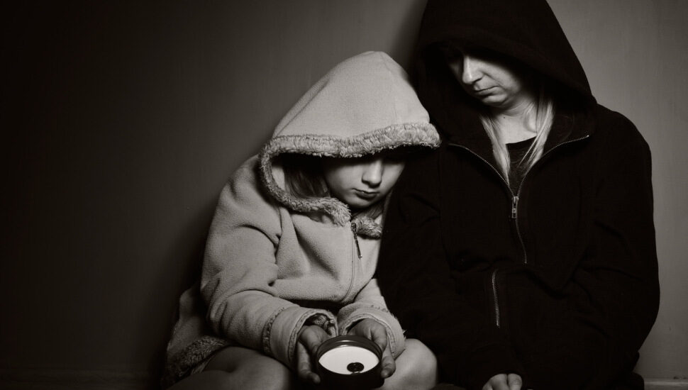 woman and child in hoodies