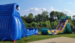 kids playing on Bounce Around Bucks' inflatable party rentals
