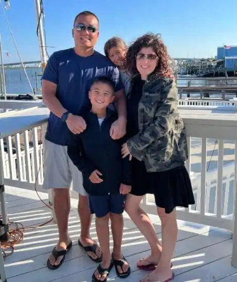 Elyse at the shore with her husband and two children.