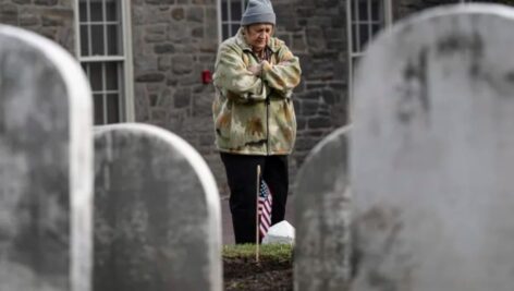 Rita O’Vary visits the gravesite of Joseph Zarelli on Thursday at Ivy Hill Cemetery in Philadelphia