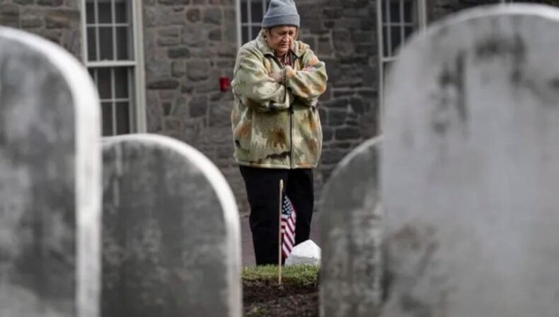 Rita O’Vary visits the gravesite of Joseph Zarelli on Thursday at Ivy Hill Cemetery in Philadelphia