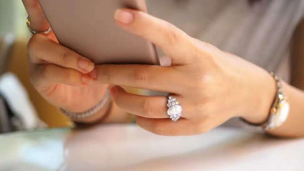 Woman wearing an expensive watch and ring