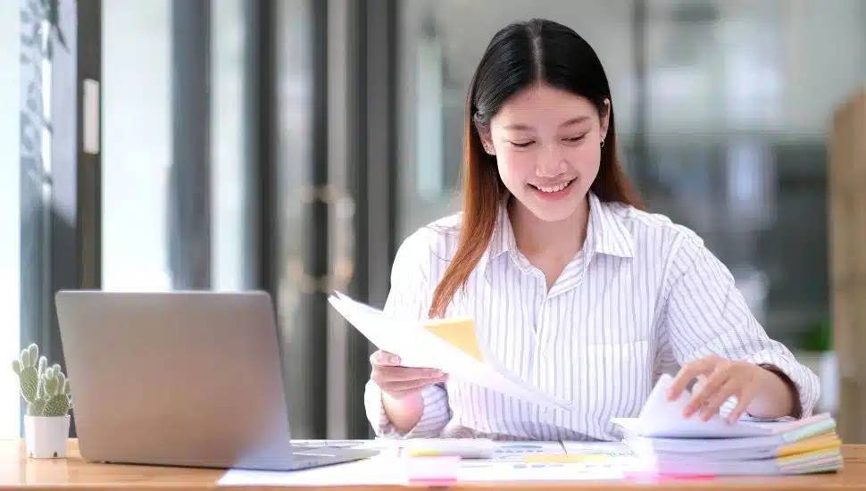 college program manager working at desk
