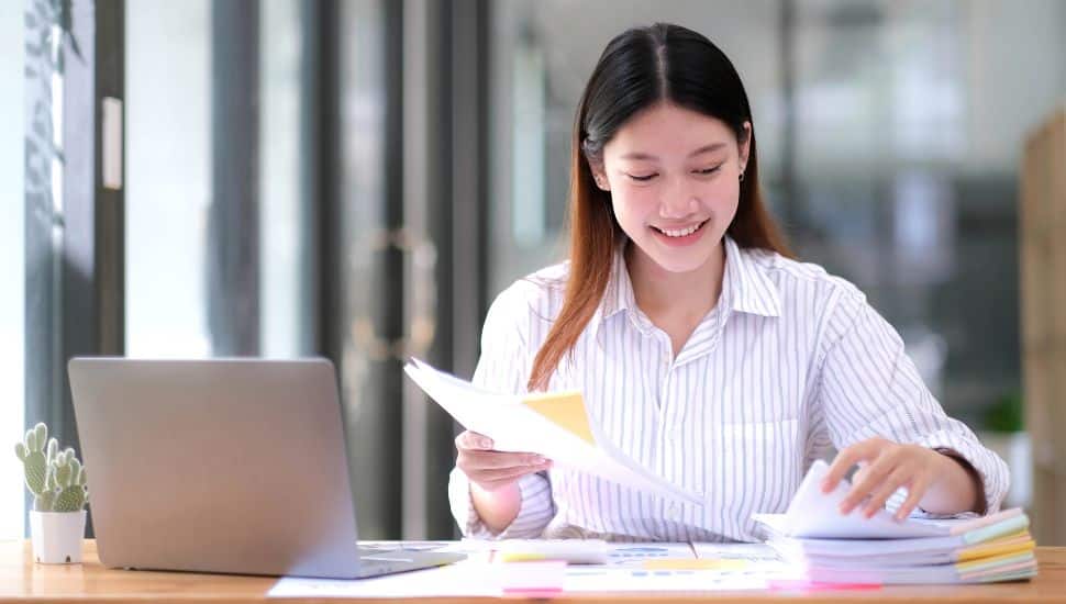 college program manager working at desk