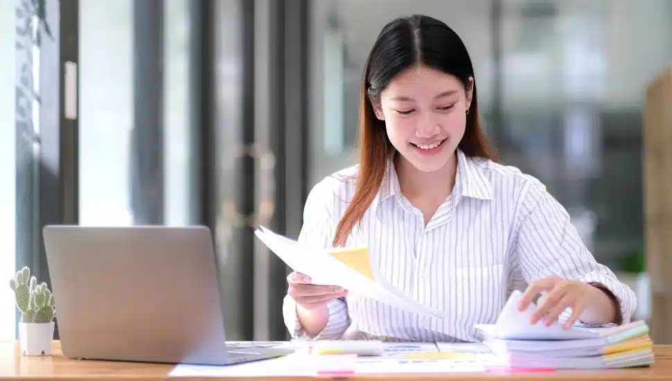college program manager working at desk