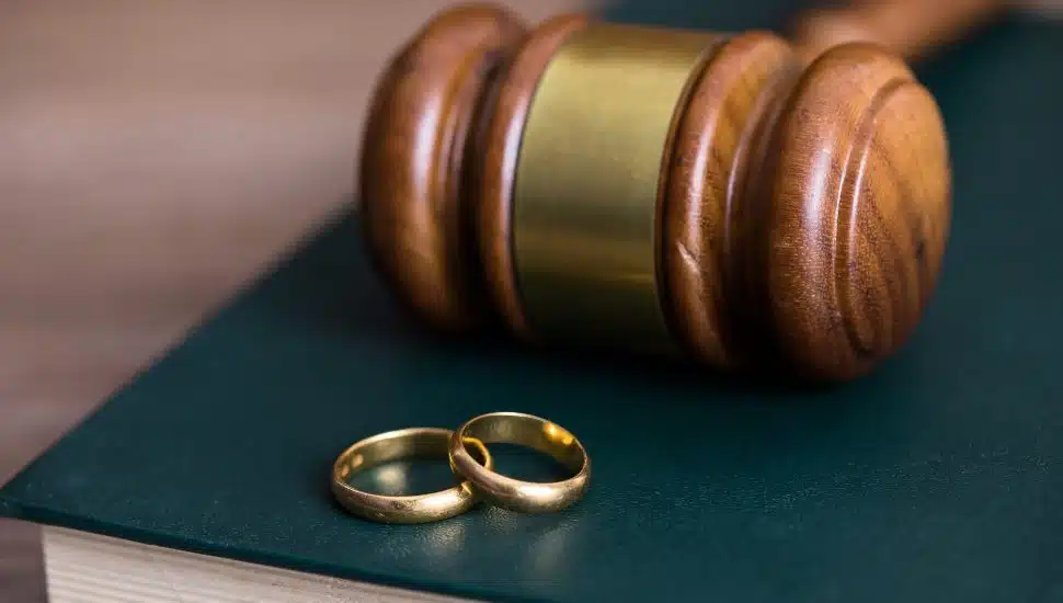 rings with judge on book on table